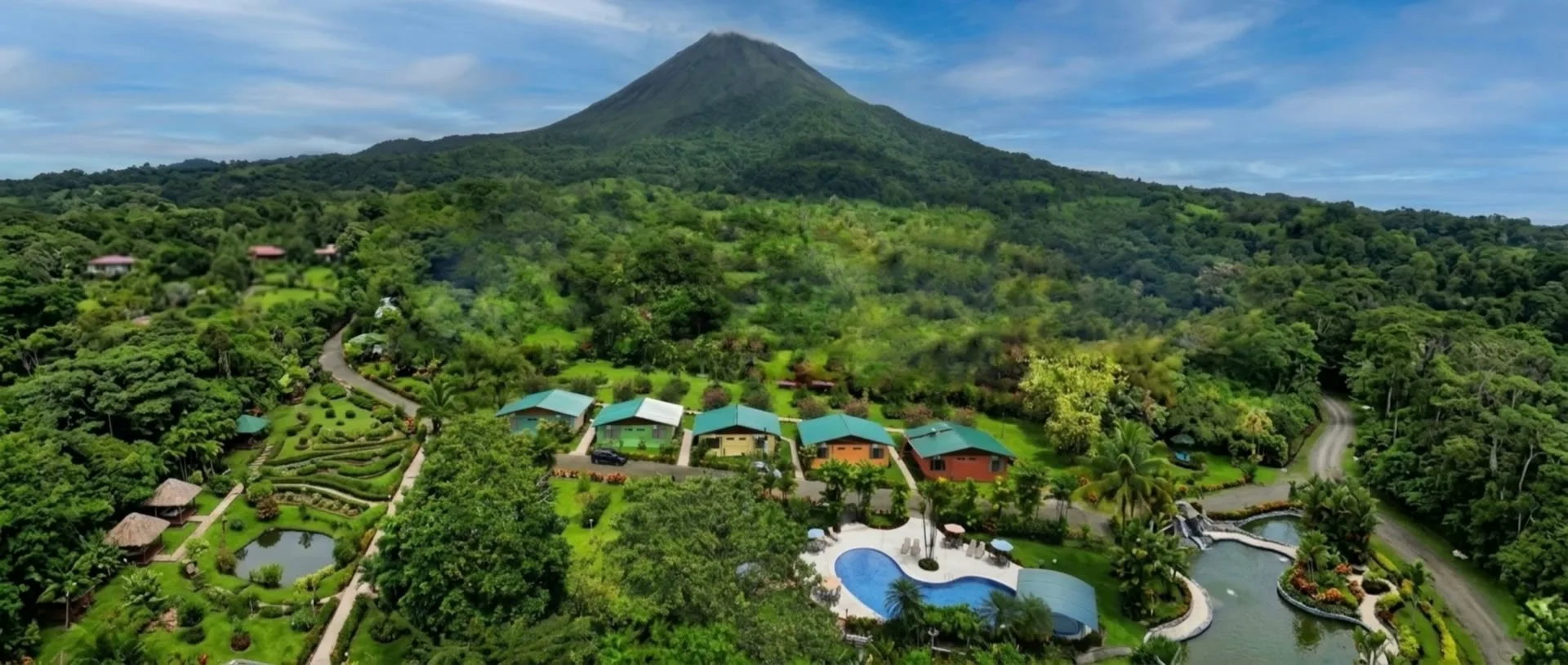 Hotel Villas Vilma gardens, pool, and Arenal Volcano